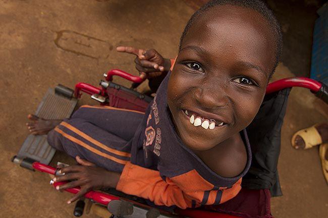 Child in wheelchair smiling